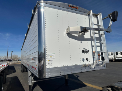 Timptre? Timpte Super Hopper trailer rear angle showing 78" sides, aluminum exterior, ladder and hitch visible.
