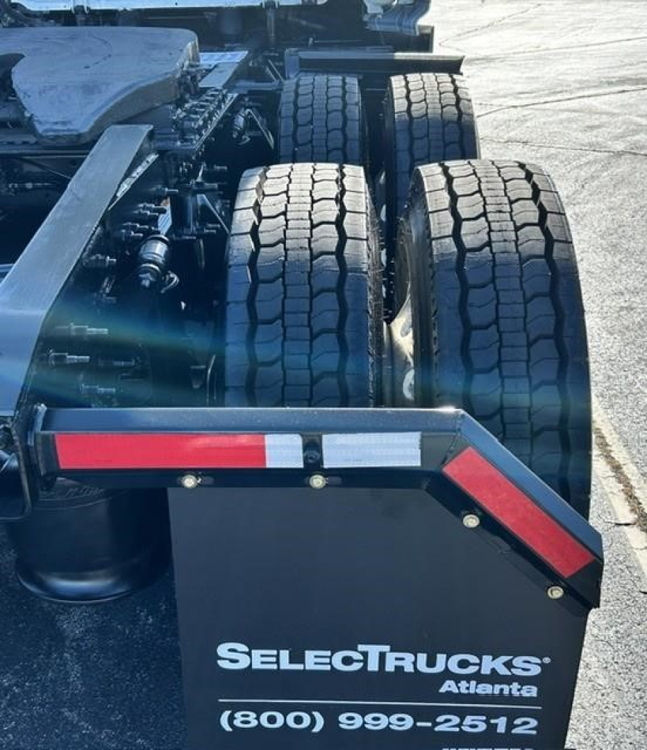 Freightliner Cascadia 126 rear view showing dual rear axles and mudflap with SelectTrucks Atlanta branding.
