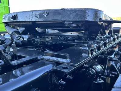 Freightliner Cascadia 126 chassis frame rail with engine and components visible, top view showing structural beams and mounting hardware.