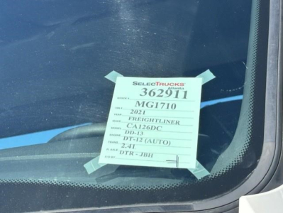 Tag on windshield showing stock number 362911, model MG1710, year 2021 Freightliner Cascadia 126 Day Cab truck.