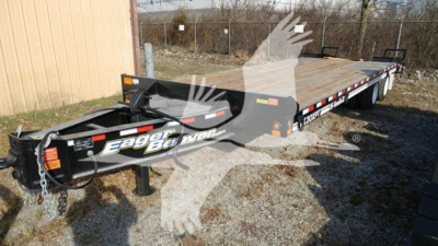 Trailer front-left view of a new 2026 Eager Beaver 20Xpt flatbed trailer showing gooseneck hitch, wooden deck, black frame, and reflective safety rails.