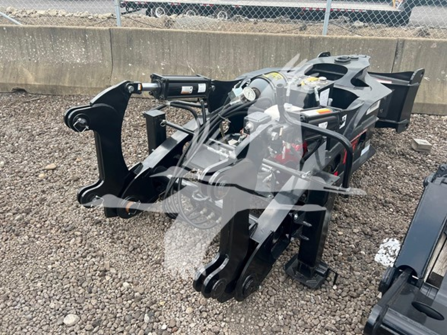 Hydraulic-based trailer hitch arm assembly for a Fontaine 55Mx lowboy trailer showing hydraulic cylinders and coupling hardware.