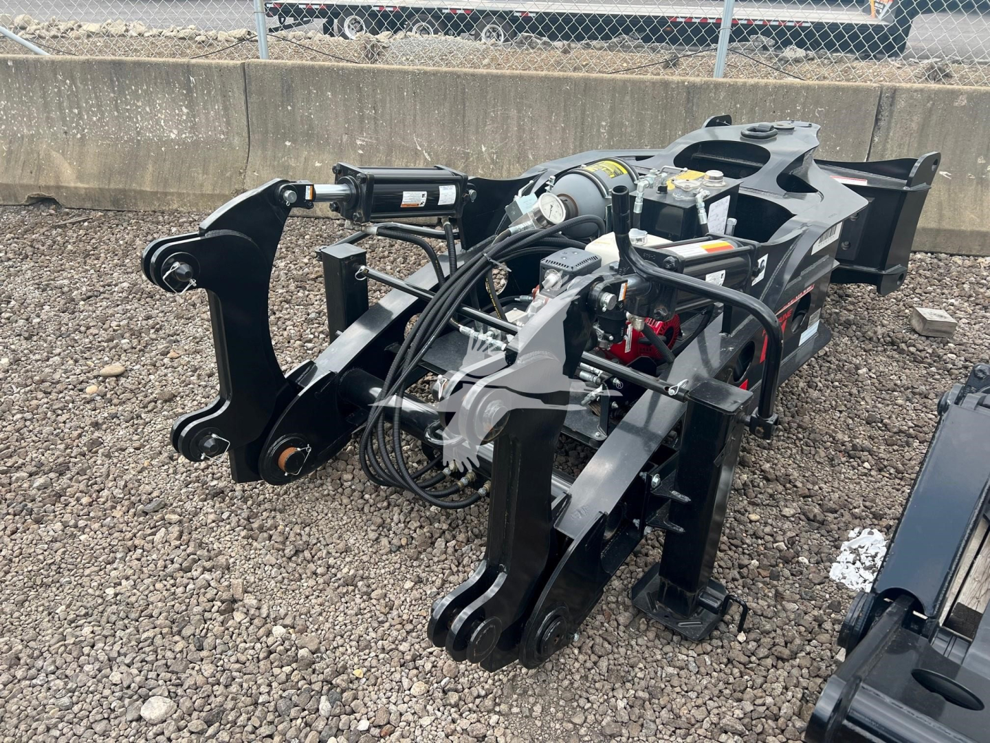 Equipment hitch attachment for a Fontaine EQ-1 lowboy trailer showing hydraulic hoses, control valve, and mounting frame.