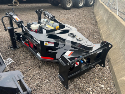 Fontaine EQ-1 lowboy trailer with hydraulic unit and front hitch, visible warning labels, hydraulic hoses, and black framing. Text on side reads Fontaine or EQ-1 components; visible stickers and safety decals.
