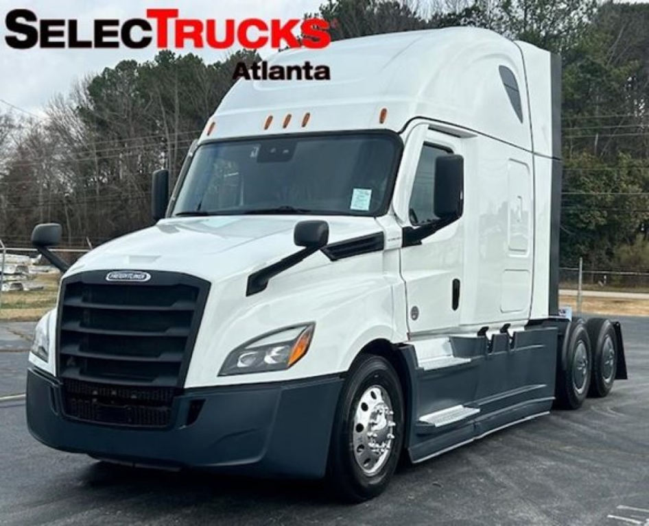 Freightliner Cascadia 126 tractor-trailer in white with black grille, side mirrors, and sleeper cab; SelectTrucks Atlanta logo on image.