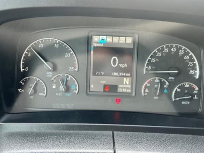 Dashboard of a Freightliner Cascadia 126 showing digital screen with speed 0 mph, odometer 480,394 miles, gear N, and surrounding gauges displaying RPM, fuel, oil pressure, voltage.