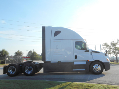 Freightliner Cascadia 126 sleeper tractor in side profile showing cab with aerodynamic fairings and dual rear axles.