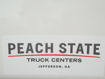 Trucks: Freightliner Cascadia 126 listing with Peach State Truck Centers sign visible
