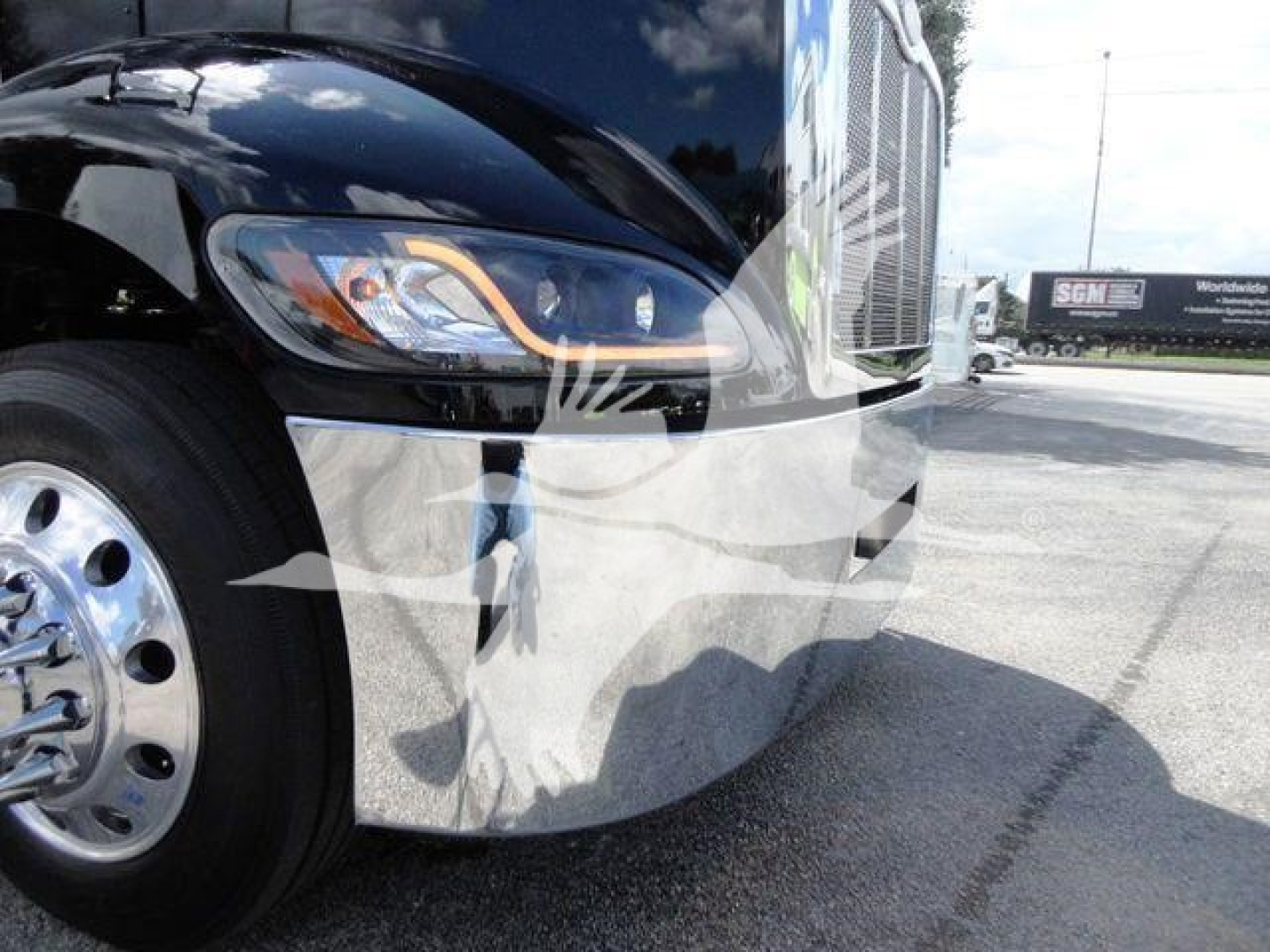 Peterbilt 337 truck front fender and headlight area showing chrome bumper and wheel well.