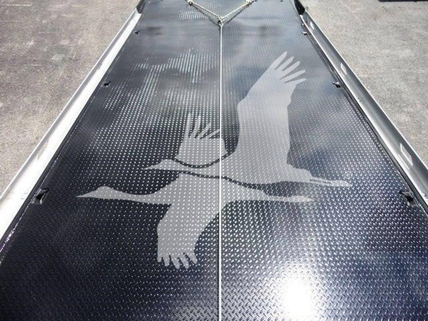Peterbilt 337 rollback truck deck with diamond plate pattern and eagle decal image.