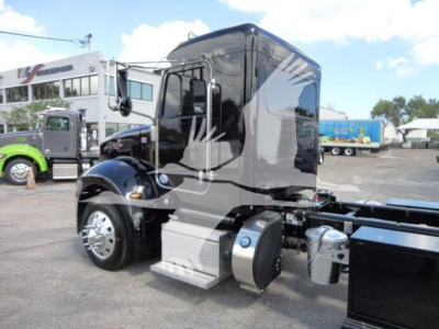 Peterbilt 337 cab and rolling chassis side view showing sleeper cab, fuel tanks, and steps.