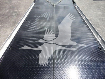 Peterbilt 337 rollback truck deck with diamond plate pattern and eagle decal image.