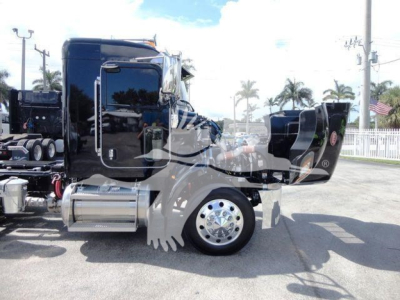 Peterbilt 337 truck in rollback configuration showing side view with fuel tanks and wheel, stock number J03058.