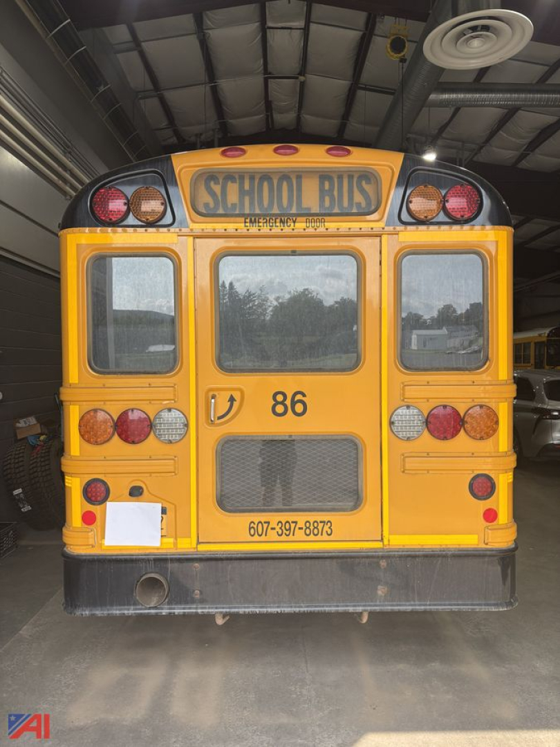 Rear view of a yellow school bus with 'SCHOOL BUS' sign, multiple lights, rear window, and the number 86; contact number 607-397-8873 visible.