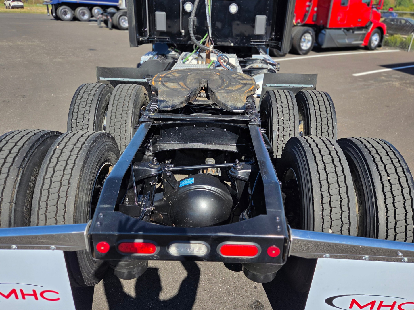 Peterbilt 579 chassisView showing rear dual-axle setup and fifth-wheel hitch with multiple air lines and brake components visible.
