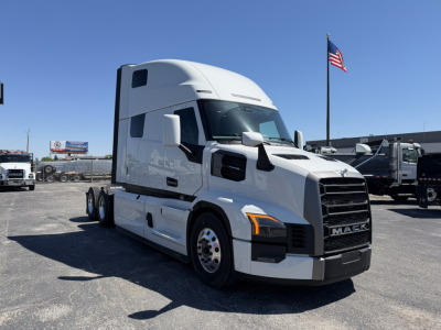 Truck in a dealership lot showing a white 2027 Mack PR64T76H sleeper cab tractor with VIN 1M1PR4GY4VM102988 and stock 72281.