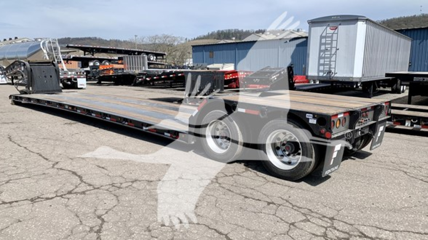 New Fontaine Renegade N12 lowboy trailer showing flatbed deck and dual wheel rear with safety lights