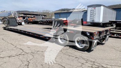 New Fontaine Renegade N12 lowboy trailer showing flatbed deck and dual wheel rear with safety lights