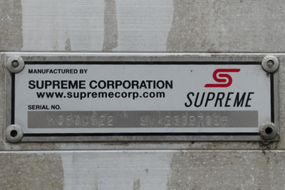 Plate on vehicle showing SUPREME logo and manufactured by SUPREME CORPORATION, serial number 105024522 and SWA20097096.