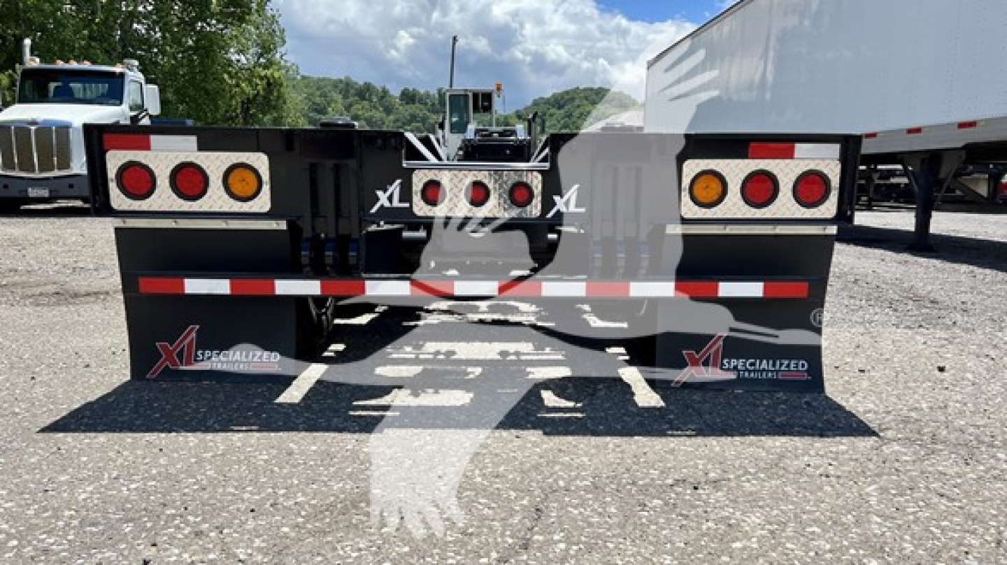 XL Specialized XL110HDGS lowboy trailer rear view showing taillights and mud flaps with XL logos