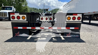 XL Specialized XL110HDGS lowboy trailer rear view showing taillights and mud flaps with XL logos