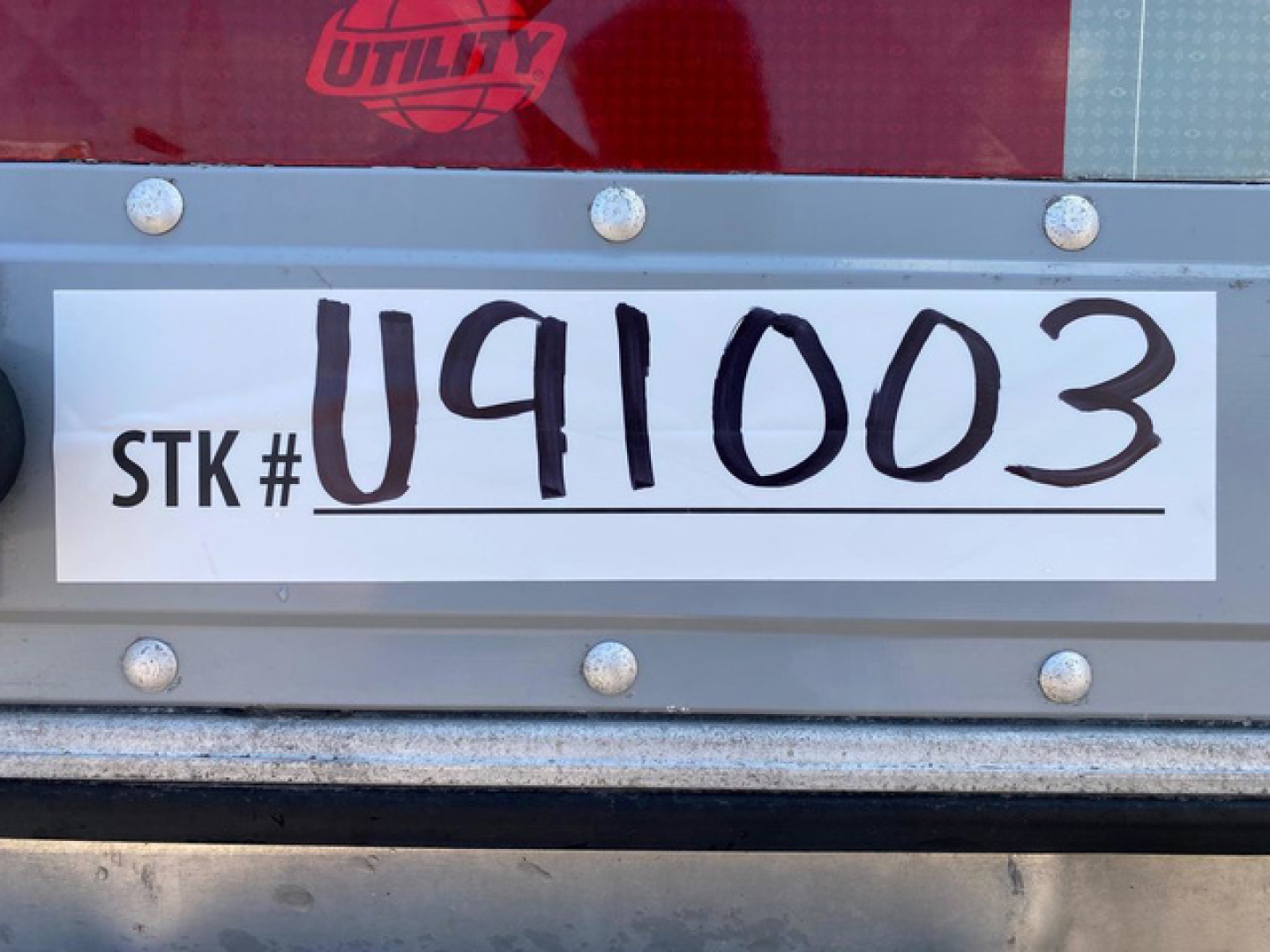 Trailer rear showing stock number plate reading STK # U91003 on a Utility Reefer 2021 refrigerated trailer.