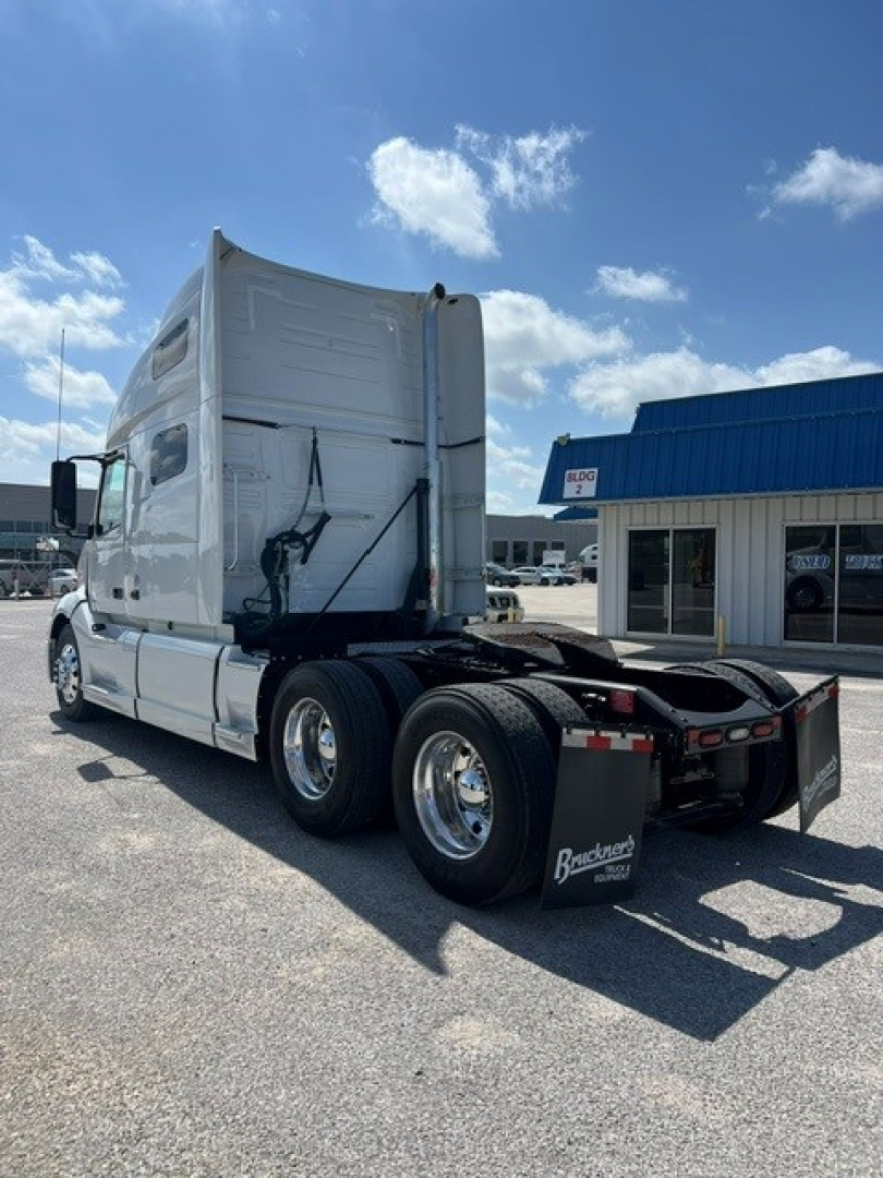 Volvo VNL64T760 sleeper cab tractor showing rear view with dual rear axles and fifth wheel.