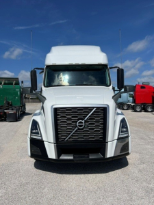  Volvo VNL64T760 truck front view showing large grille with Volvo emblem and rectangular headlights.