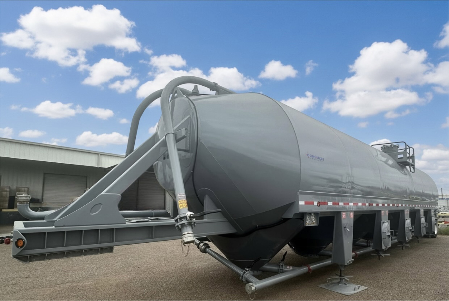 Portable cement storage silo trailer showing large cylindrical tank on multi-axle chassis with loading arm and support legs.