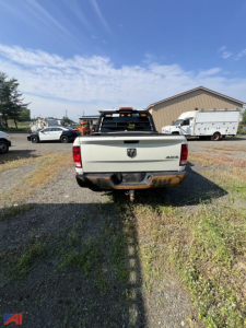 2018 Ram 1500 Tradesman Crew Cab pickup truck rear view showing bumper hitch and rusted hitch area.