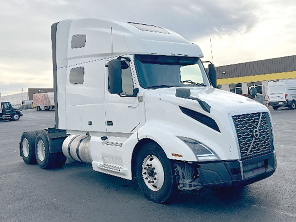 Volvo VNL 760 conventional sleeper tractor from front-left view showing cab, grille, headlights, and dual rear axles.