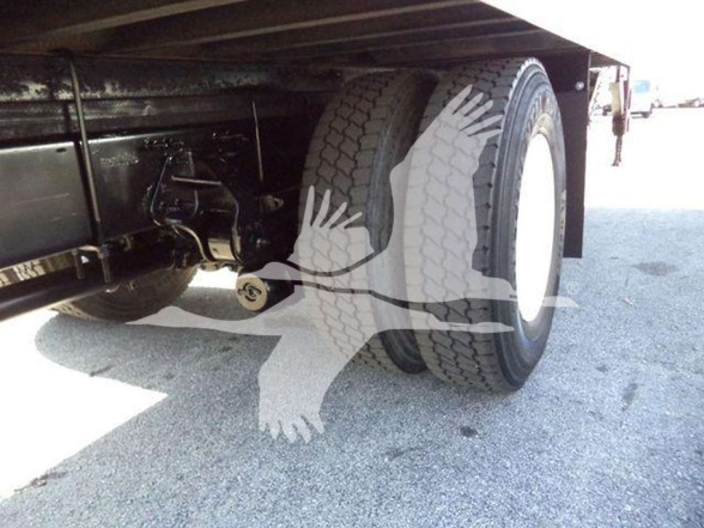 Hino 268A truck rear underside showing dual rear wheels and suspension components.