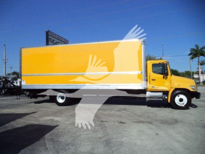 2019 Hino 268A box truck showing side view with yellow cargo box and cab.
