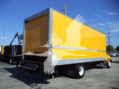2019 Hino 268A box truck showing side yellow cargo body, rear undercarriage and wheel, stock label visible.