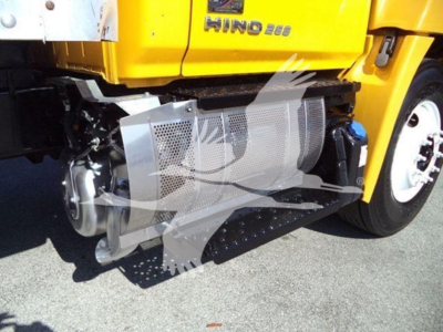 Hino 268A truck side view showing engine area and a metal perforated guard near the front wheel.