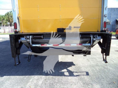 Hino 268A rear view showing underbody mechanical components and lift gates.