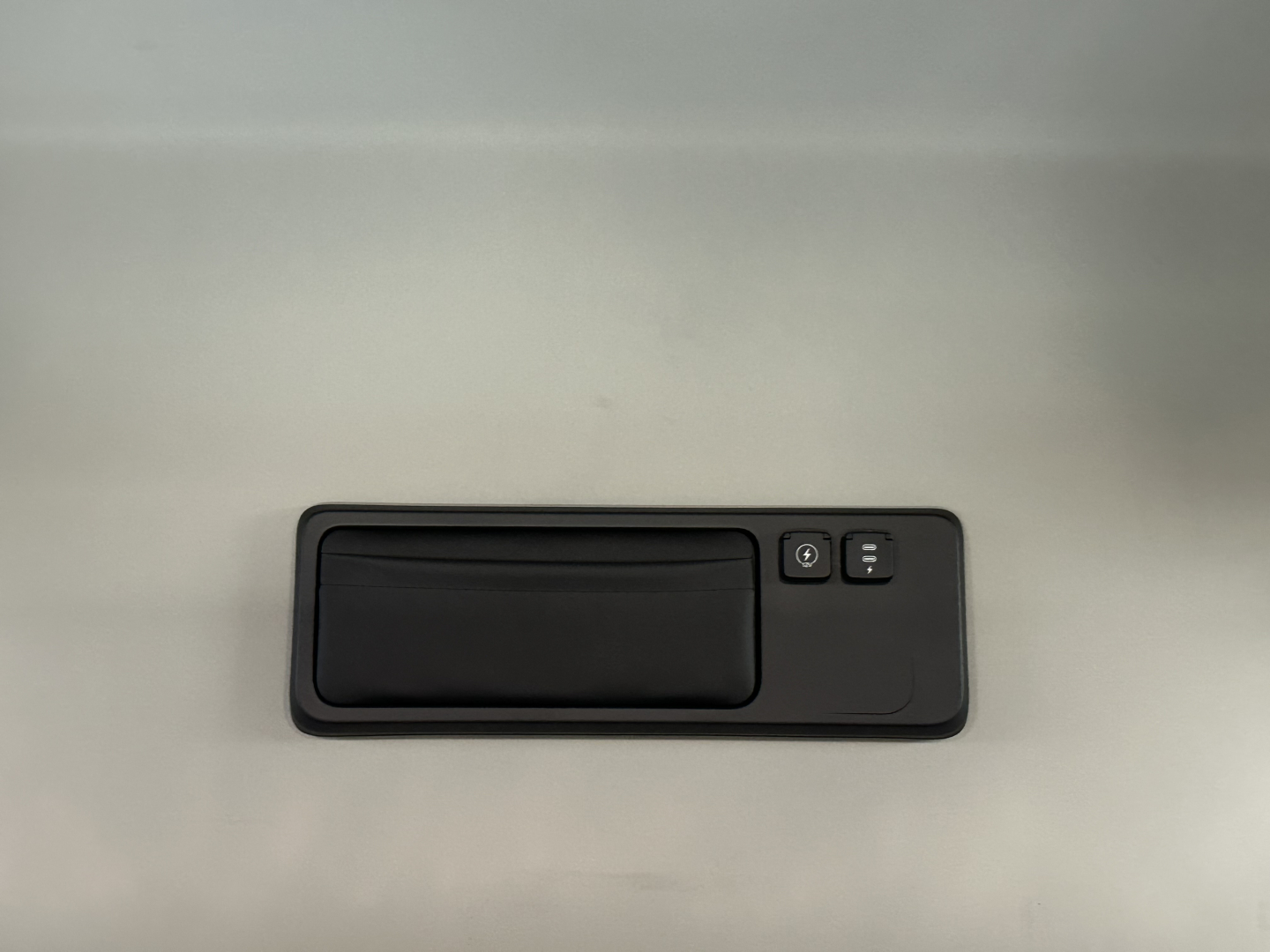 Interior door panel handle with window/lock controls in a Mack PR64T76H truck cab.