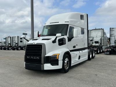 Mack PR64T76H conventional sleeper truck in a parking lot showing front and side profile.