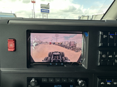 Dashboard view showing rearview camera display in Mack PR64T76H truck cab.