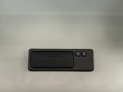 Interior door panel handle with window/lock controls in a Mack PR64T76H truck cab.