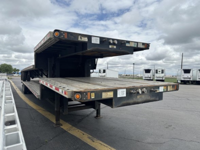 Semi-trailer tandem drop deck with rear slide axle showing loading platform and undercarriage.