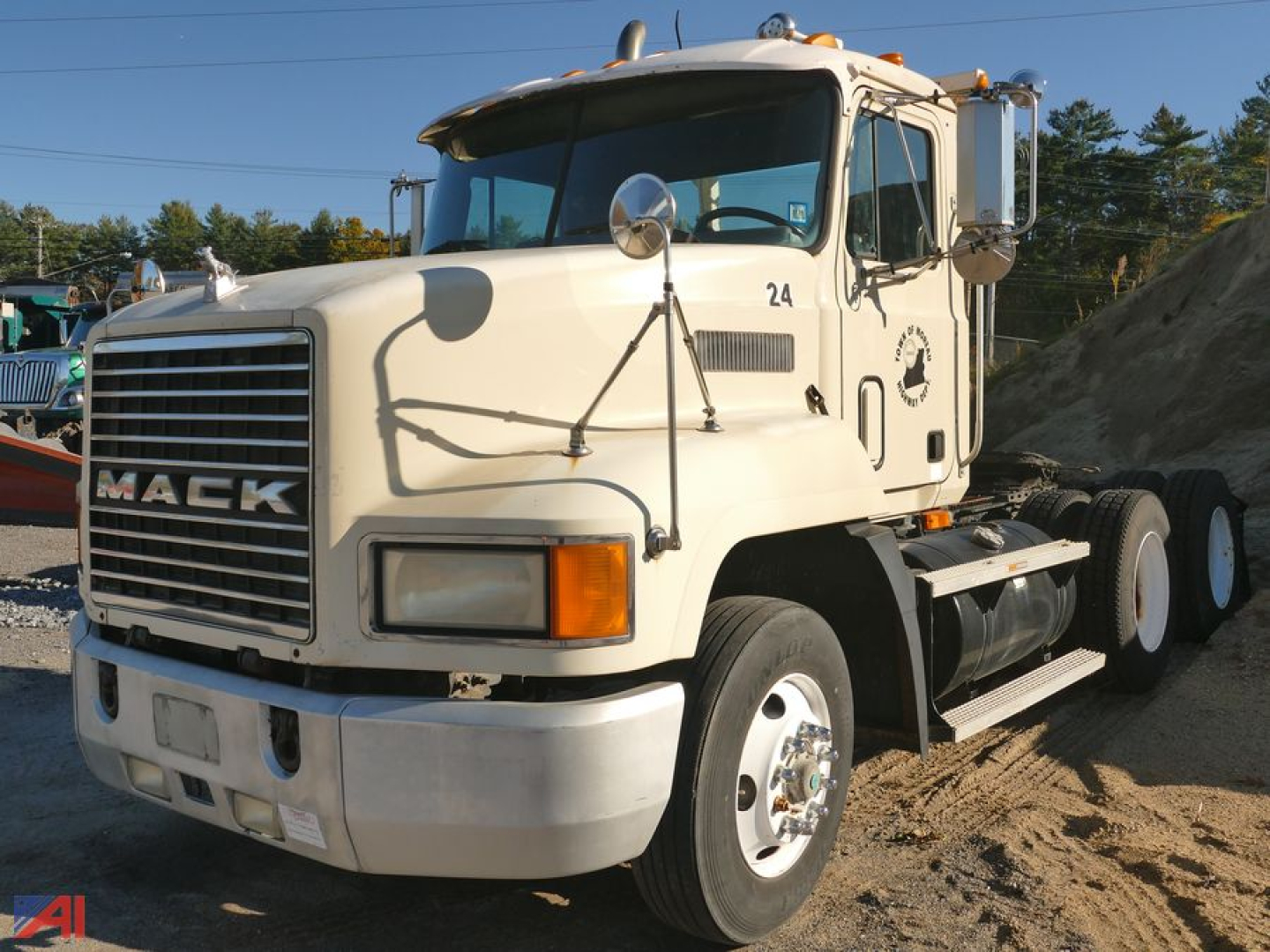 Tractor truck cab (Mack CH613) with large front grille, windshield, side mirrors, steps, and dual rear wheels. Visible text includes MACK on grille and number 24 on door.