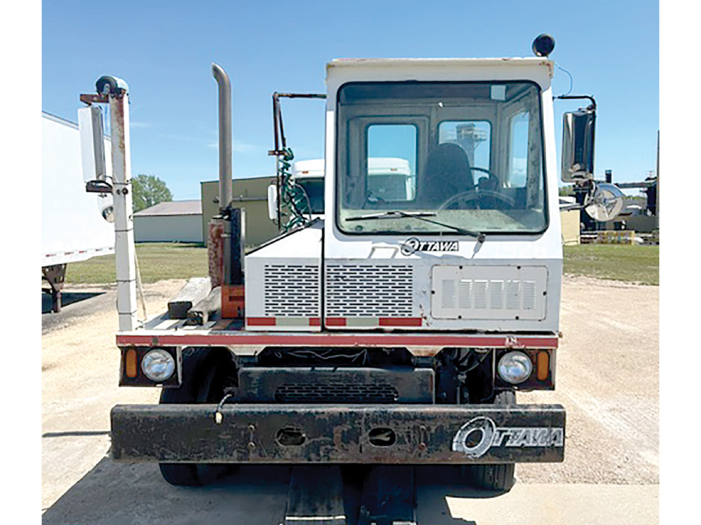 Ottawa YT-30 yard truck front view showing cab with Ottawa logo, large bumper, headlights, and rugged frame.