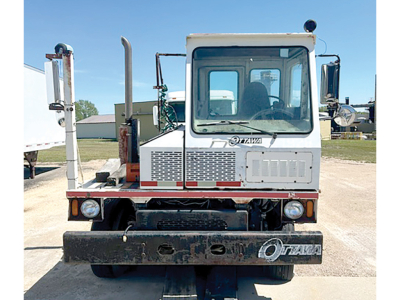 Ottawa YT-30 yard truck front view showing cab with Ottawa logo, large bumper, headlights, and rugged frame.
