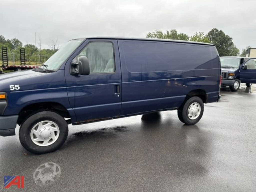 Ford E-350 cargo van side view showing solid blue exterior with black front trim and wheel wells
