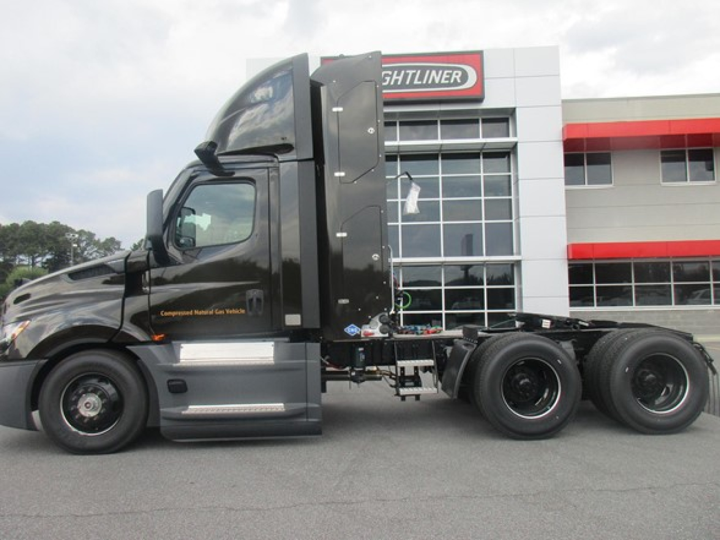 Freightliner Cascadia 126 Day Cab side view showing tractor chassis and cab with new condition. VIN and stock not visible on image.