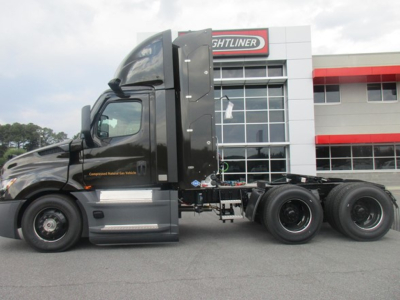 Freightliner Cascadia 126 Day Cab side view showing tractor chassis and cab with new condition. VIN and stock not visible on image.