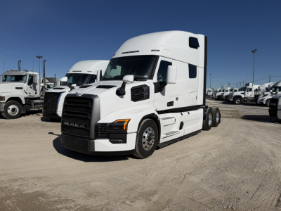 Mack PR64T76H conventional sleeper tractor in a dealer lot, white with black grille, showing front and side views