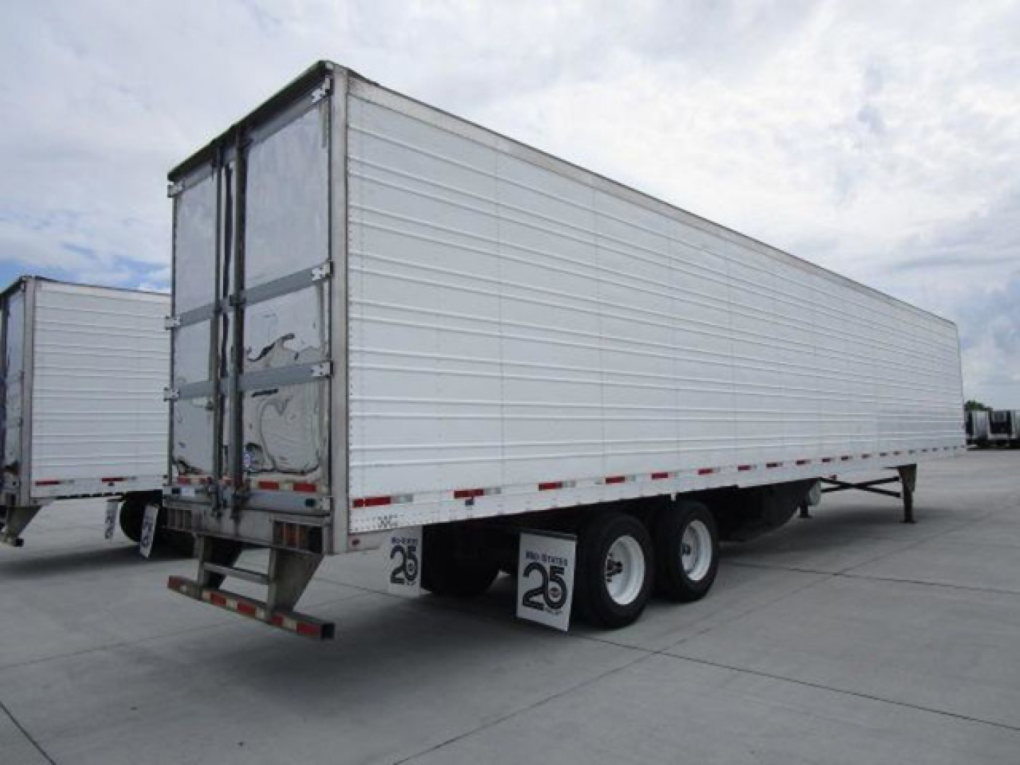 Used 2019 Utility reefer trailer showing side panel, rear doors, triple axle with dual tires, and stock number U90988.