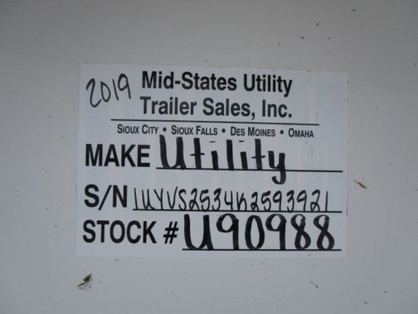 Trailer label showing 2019 Mid-States Utility Trailer Sales, Inc. S/N 1UYVS2534K2593921, STOCK # U90988.